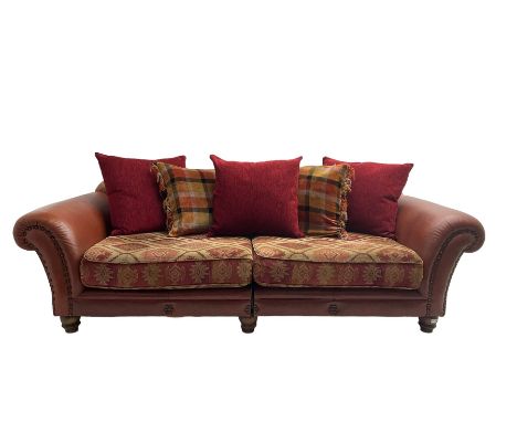 Grande traditional design four seat sofa, upholstered in studded red leather and kilim style fabric, with contrasting scatter