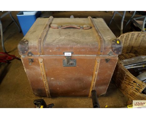 A canvas and wooden bound travelling trunk 