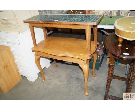 A golden oak occasional table and tile topped table