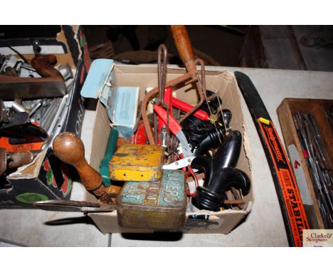 A box of various hand tools to include saws; pliers etc