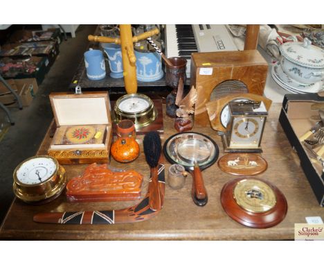 A quantity of various wooden items to include a vintage speaker, a mounted clock barometer, boomerang, mantle clocks, Smiths 