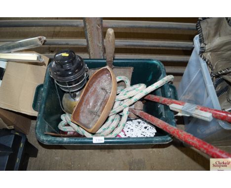 A plastic box containing a Tilly lamp, shovel, pipe bender etc