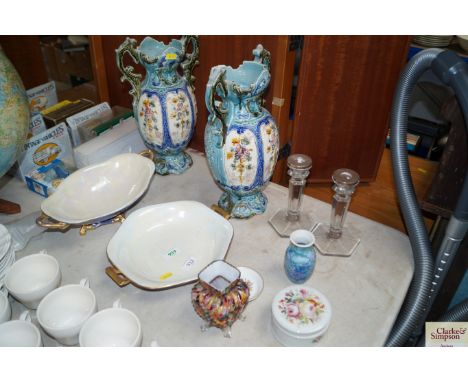 A pair of floral decorated twin handled vases AF, together with a pair of glass and silver collared candle sticks, Royal Worc