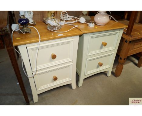 A pair of modern cream and light oak beside chests, each fitted two drawer
