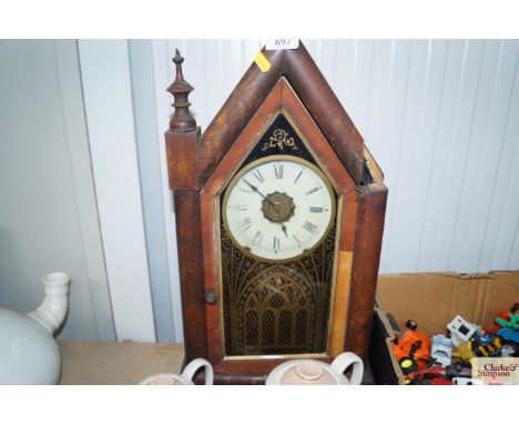 An American mantel clock of Gothic form