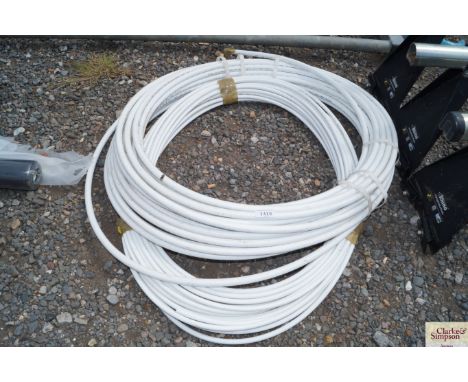 Two reels of plastic pipe