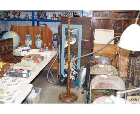 A mahogany standard lamp (lacking shade)