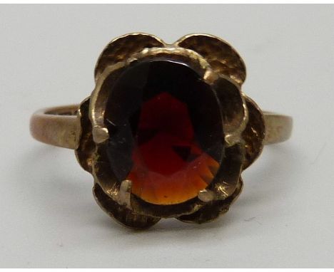 A 9ct gold and red stone set ring, 2.7g, K 