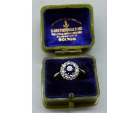 An 18ct gold, sapphire and diamond cluster ring, 2.6g, L 