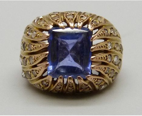 A yellow metal, diamond and blue stone ring, 8g, G, (the stone tests as blue topaz, the metal tests as 14ct) 