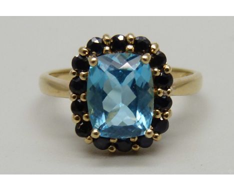 A 9ct gold, blue topaz and sapphire ring, blue topaz 9.08mm x 7.04mm, 3g, P 