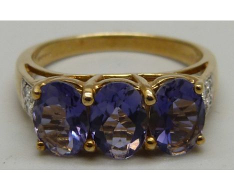 A 9ct gold, iolite and diamond ring, 3.2g, N 