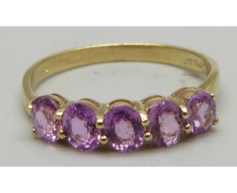 A 9ct gold and five stone pink sapphire ring, approximately 1ct total weight, 1.9g, P/Q 