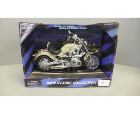 A 1:9 scale BMW motorcycle, boxed 