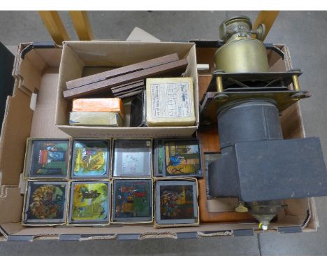 Magic lantern projector with eighty assorted glass slides including Cinderella, Robinson Crusoe, Little Red Riding Hood, Don 