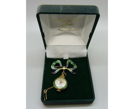 A gold and enamel nurse's brooch watch, marked 750 