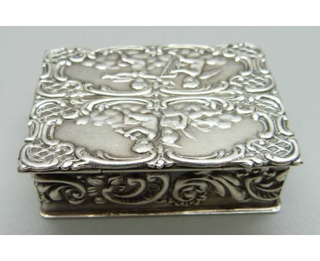 A hallmarked silver box embossed with angels playing musical instruments, Sheffield 1970, 42mm 