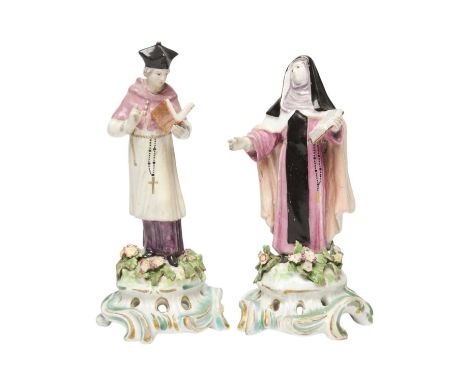 A pair of Bow religious figures, c.1760-65, of a canon and a canoness, each standing and holding an open prayer book, the pri
