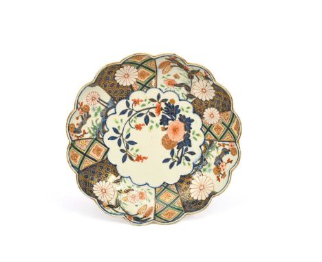 A Chelsea dessert dish, c.1752-58, richly decorated in the Imari palette with the Brocade pattern, with sprays of flowering c