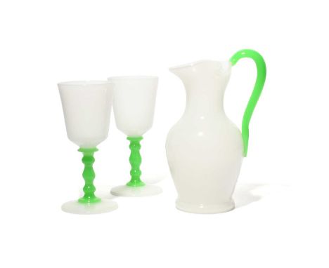 A Steuben glass lemonade jug and two goblets, late 19th/20th century, with a white opaline body, the handle and glass stems o