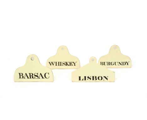 Four creamware wine or bin labels, c.1800, of coathanger form, three with rounded shoulders, variously titled in black with '