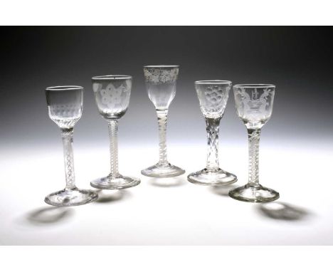 Five small wine glasses, c.1760-80, with round funnel and ogee bowls, one engraved in the Jacobite manner with a rose and but