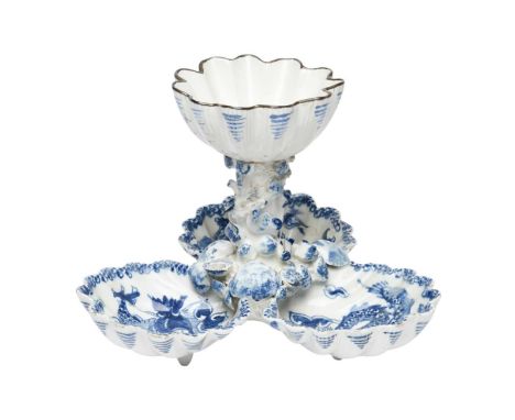 A Bow blue and white sweetmeat stand, c.1760, formed with three scallop shells painted with the Dragon pattern, with a centra