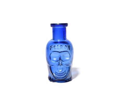 A small Death's Head glass poison bottle, late 19th/early 20th century, the glass cobalt blue, modelled as a skull with 'Pois