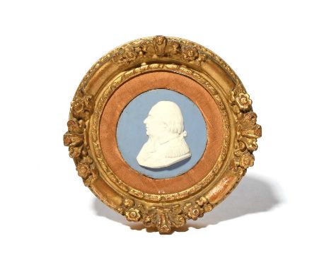 A Sèvres biscuit porcelain plaque of Louis XVIII, c.1814-24, modelled in white relief on a blue ground with a profile portrai