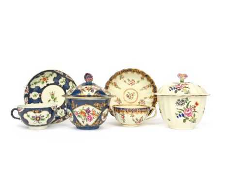 Two Worcester sucriers and covers, c.1760-70, one painted with fan panels of flowers reserved on a wet blue ground, the other