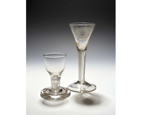 A Jacobite wine glass, c.1760, the drawn trumpet bowl engraved with a large rose and bud spray over a dense airtwist stem, an