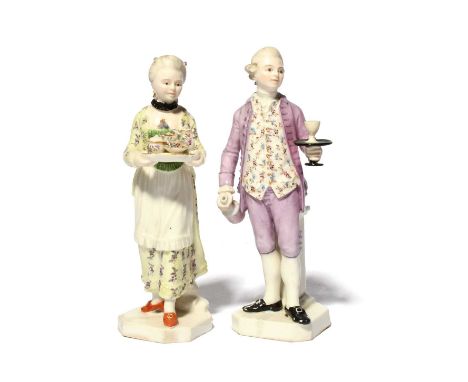 A rare pair of Zurich figures of servants (Diener und Dienerin), c.1770-80, one modelled as a butler or footman, holding a gl