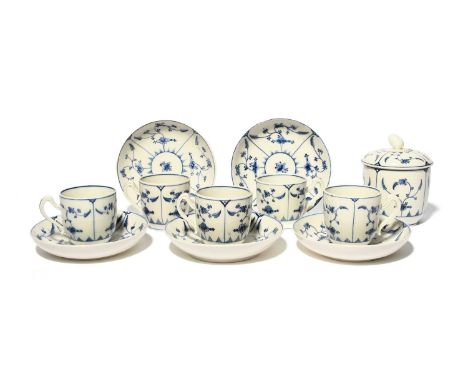 A Tournai part tea or coffee service, c.1770, painted in underglaze blue with a panelled Chantilly sprig design. Comprising: 