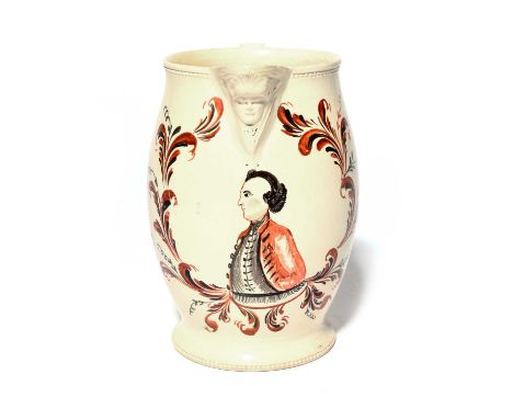 A rare political creamware jug, 2nd half 18th century, the barrel shape painted in red and black with a portrait of John Wilk
