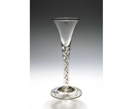 A tall wine glass or flute, c.1750, the drawn trumpet bowl rising from a double mercury twist stem over a folded conical foot