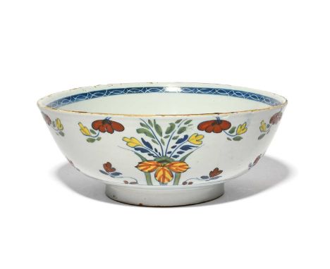 A delftware punch bowl, c.1760-70, painted to the exterior with stylised flower sprays in polychrome enamels, the interior wi
