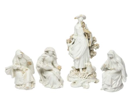 Three Bow white-glazed figures of nuns, c.1753-55, two modelled as novices, one as an abbess, each seated with one foot exten