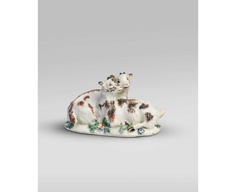A rare Chelsea figure group of goats, c.1750-52, modelled with two kids recumbent on a low pad base applied with flowers, the