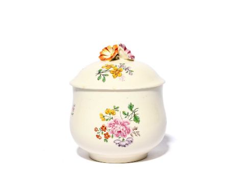A Chantilly sugar bowl and cover, c.1750, painted with delicate flower sprigs, the cover surmounted by three convolvulus type