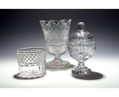A cut glass preserve jar and cover, 19th century, the spherical form heavily cut, the cover with a spoon aperture, a large ce