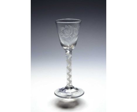 A small botanical wine glass, c.1760, the round funnel bowl engraved with a large naturalistic flower, the reverse with a but