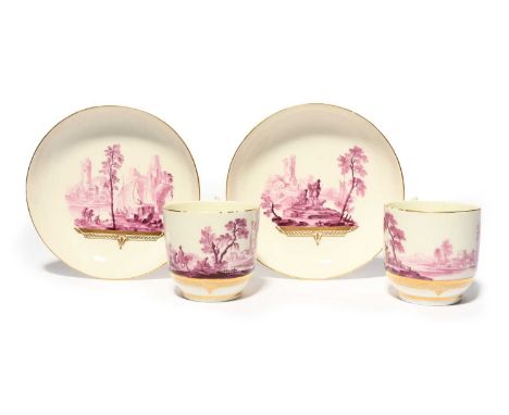 A good pair of Tournai coffee cups and saucers, c.1770, the generous forms painted in the manner of Michel-Joseph Duvivier wi