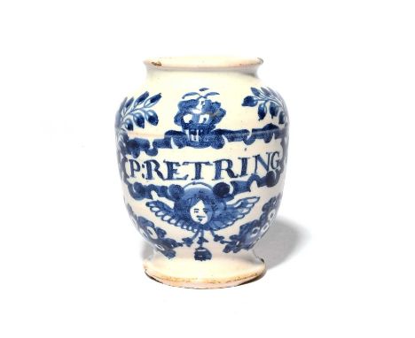 A rare London delftware pill jar, c.1725, the small ovoid form painted in blue with birds on branches flanking a basket of fr