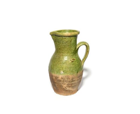 A large post-medieval Tudor Green jug, 2nd half 16th century, the tall earthenware form decorated to the upper half in a rich