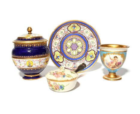 A Sèvres jar and cover, c.1790, painted with small yellow oval panels reserved on a dark blue ground, a Sèvres saucer painted