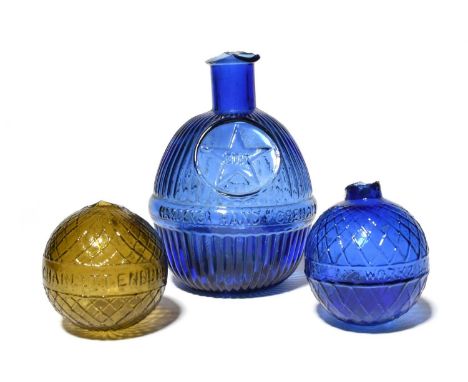 Two glass target balls, c.1880-1900, one of amber hue and moulded around the circumference with 'Charlottenburg Glashutten Dr
