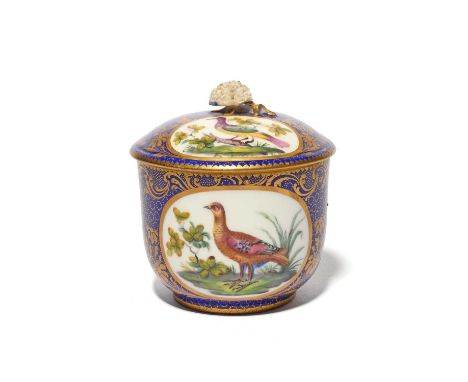 A Sèvres sucrier and cover, c.1760-70, later decorated, probably in London, with panels of colourful birds reserved within gi