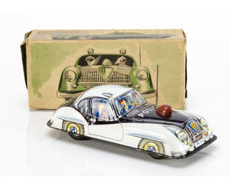 A 1950s Philip Niedermeier Jaguar XK120/140 Police Car, tinplate friction drive model, red plastic siren, wire aerial, 'PN-31