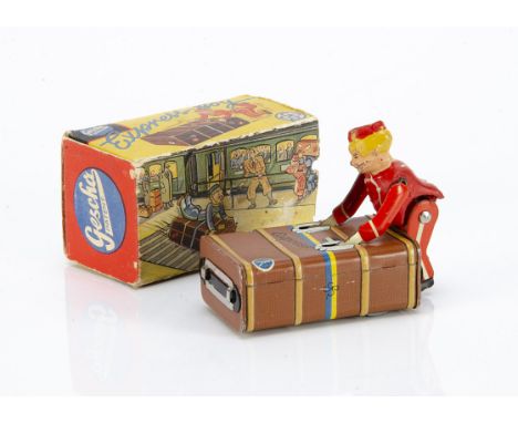 A Pre-War Gescha 'Express Boy' Luggage Porter, tinprinted clockwork brown traveling trunk with composition and tin porter in 
