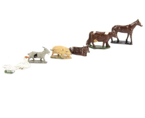 A lot of 00 Gauge farm animals by Charbens including pigs (25),  lying (25+) and standing (32) cows, horses (25+), swans (25+